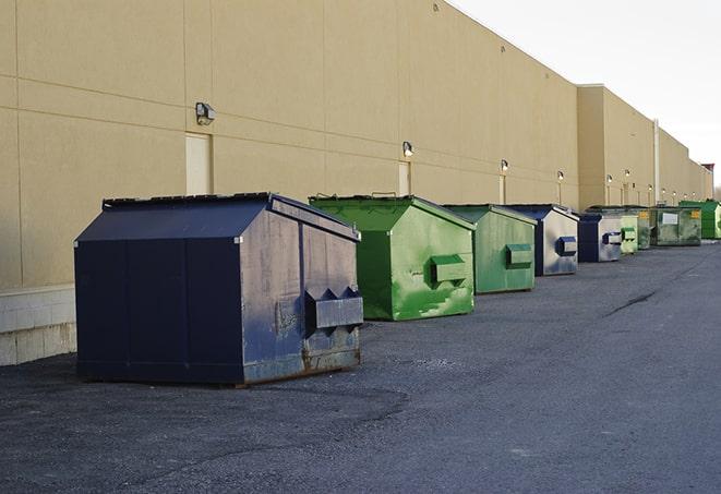 construction workers disposing of debris in large dumpsters in Buffalo City